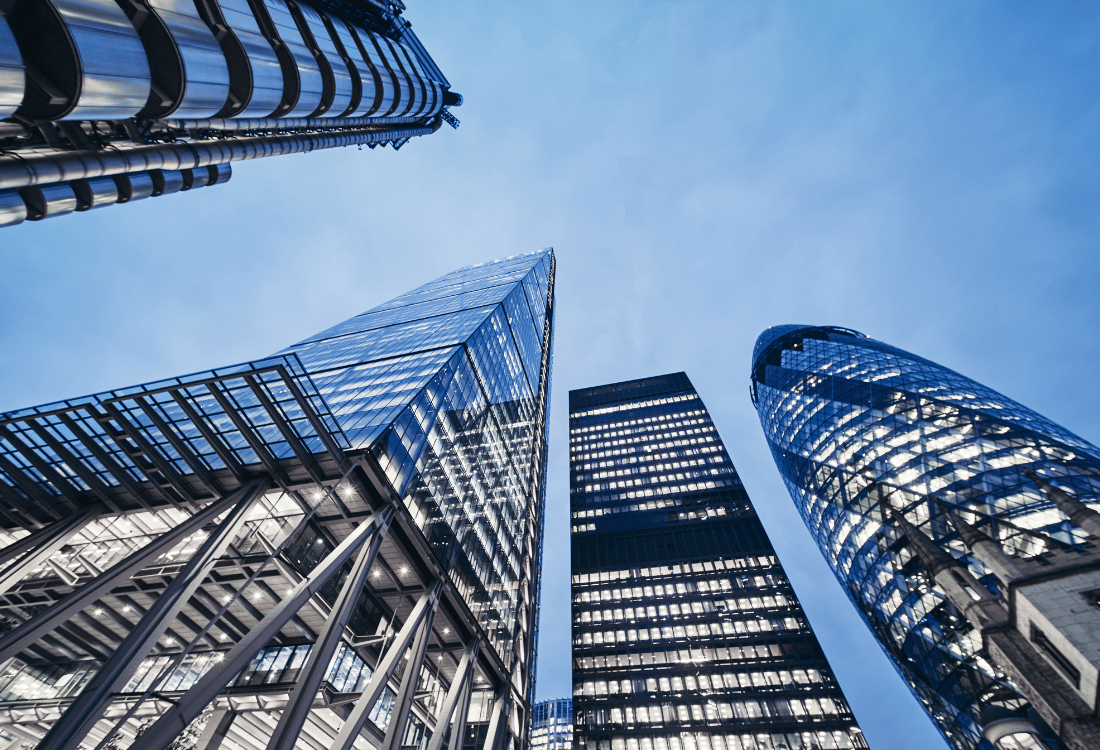 A ground view of London skyscrapers housing various financial services that could benefit from using Autus to cleanse and streamline their CRM data for the financial industry. 